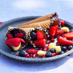 Kremmerhus fylt med frukt og bær